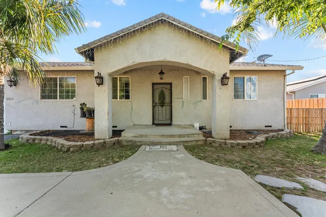 a bathroom with a granite countertop toilet sink and mirror