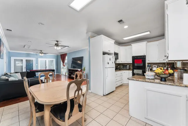 a view of a house with a snow in the yard