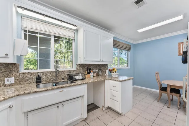 a swimming pool with lots of tress in front of it