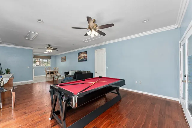 a backyard of a house with potted plants