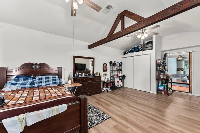 a view of a porch with furniture and a yard