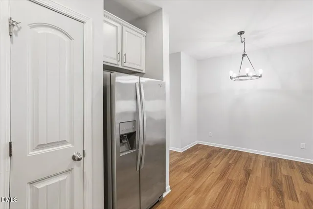 a view of a kitchen with wooden floor