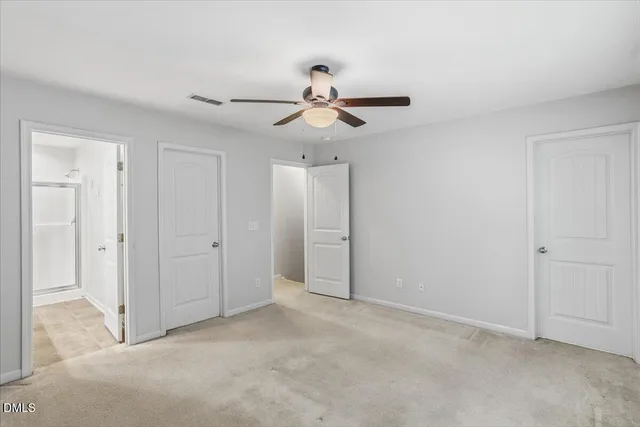 a view of a chandelier fan in a room