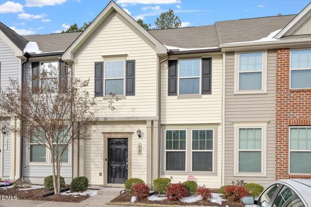 a view of a house with a table and chairs