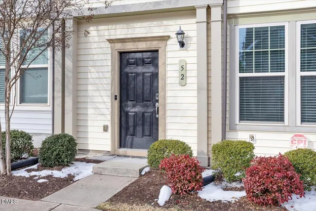 a view of a potted plant in front of a house