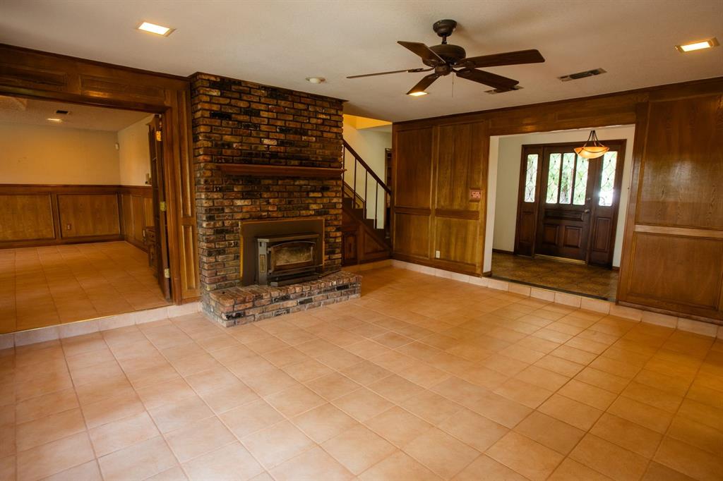 6837 Roberts Lane Fort Worth, TX 76140 - Photo 14 of 39 a view of an empty room with a ceiling fan and window