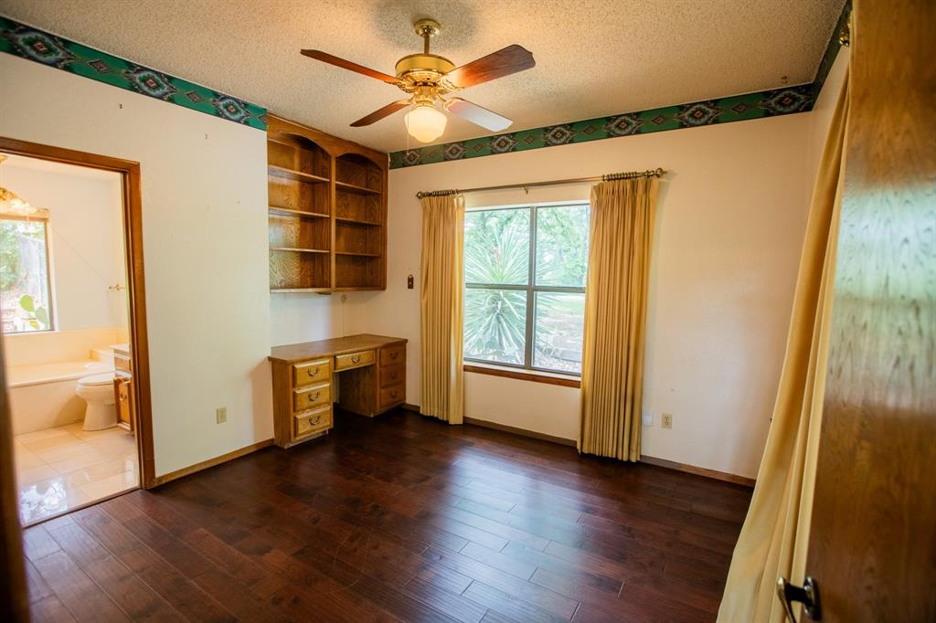 6837 Roberts Lane Fort Worth, TX 76140 - Photo 15 of 39 wooden floor in an empty room with a window