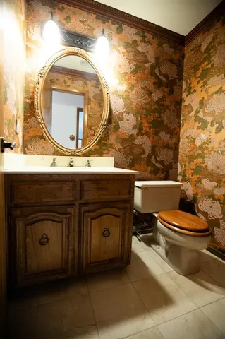 a view of a swimming pool with lawn chairs under an umbrella