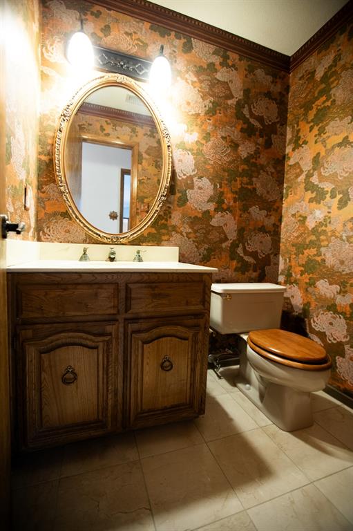 6837 Roberts Lane Fort Worth, TX 76140 - Photo 22 of 39 half bath near the stairs