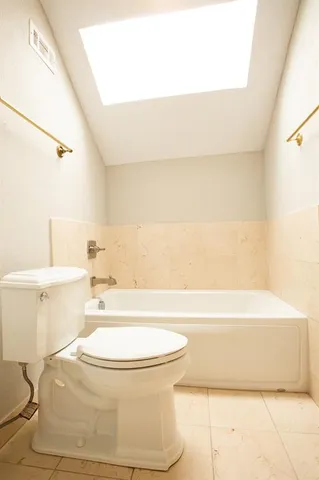 an aerial view of residential house with outdoor space and trees all around