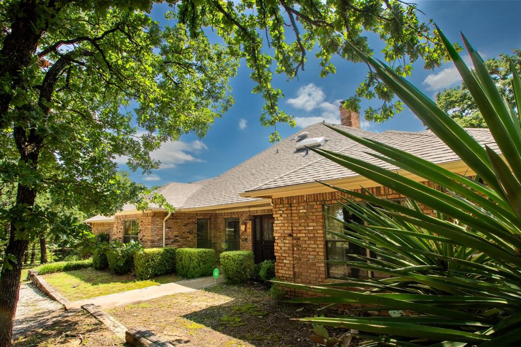 6837 Roberts Lane Fort Worth, TX 76140 - Photo 36 of 39 a front view of a house with garden