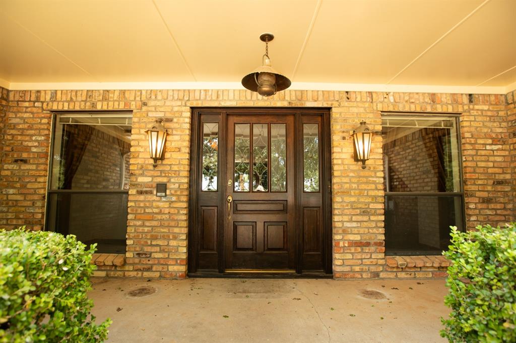 6837 Roberts Lane Fort Worth, TX 76140 - Photo 6 of 39 a front view of a house with a yard