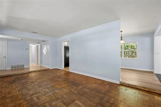 a view of an empty room and window