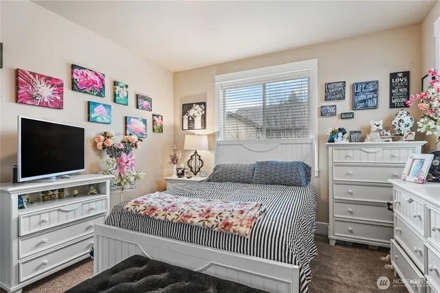 a bedroom with furniture and a window