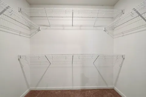 a view of a room with racks on the wall