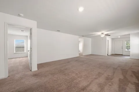 a view of a big room with windows and cabinet