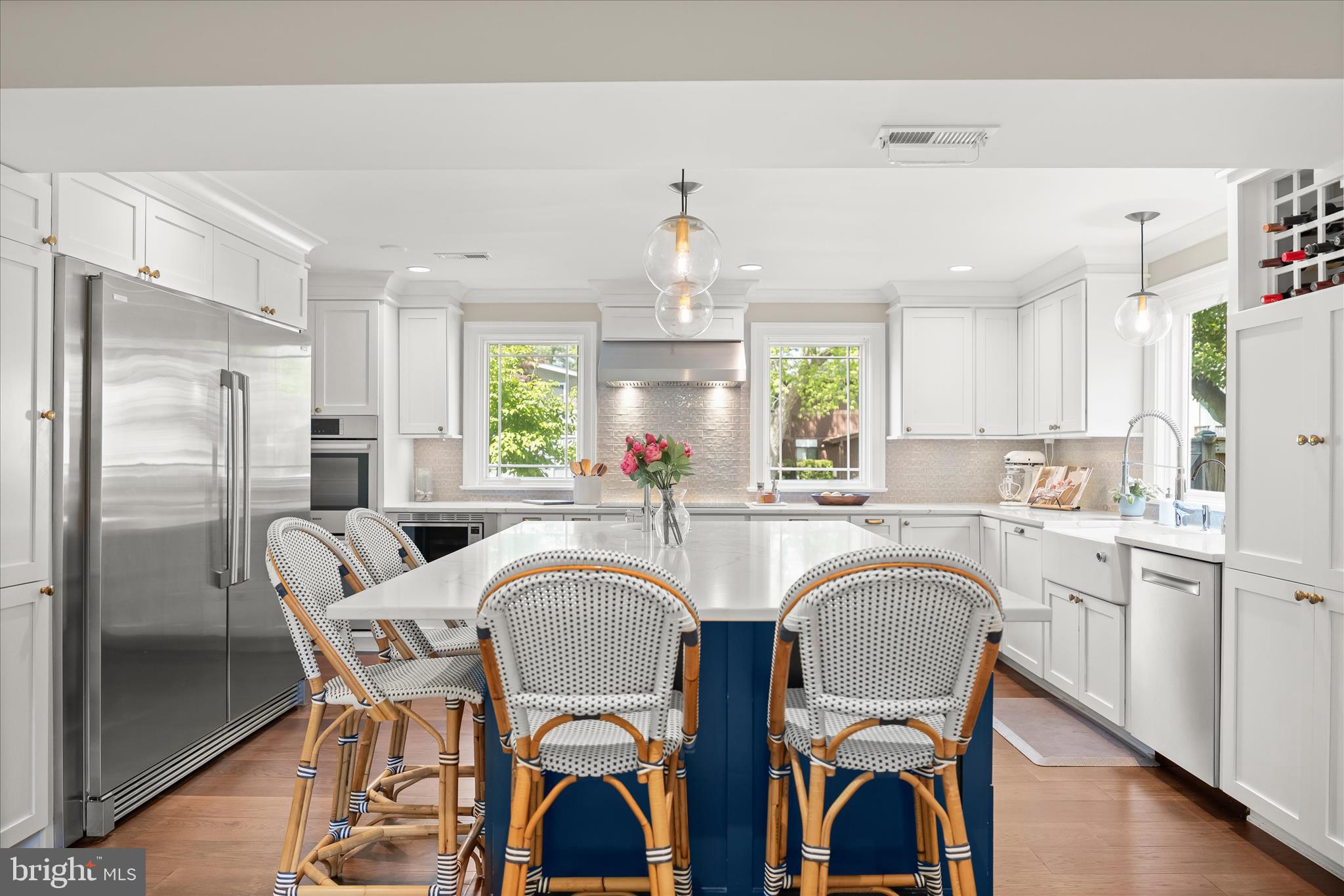 6366 11th Road North Arlington, VA 22205 - Photo 5 of 39 a kitchen with stainless steel appliances granite countertop a dining table chairs refrigerator and sink