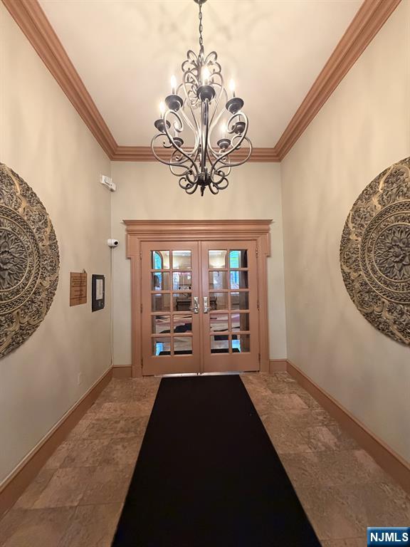 100 Prospect Avenue, Unit 5H Hackensack, NJ 07601 - Photo 2 of 17 a view of a room with window and chandelier