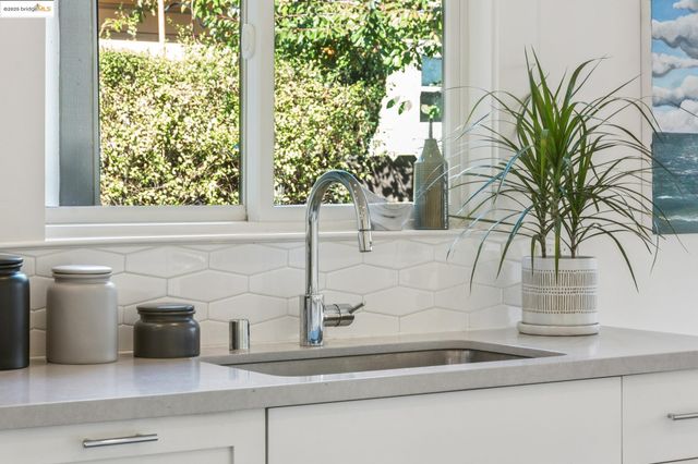 a closeup of a sink and a mirror