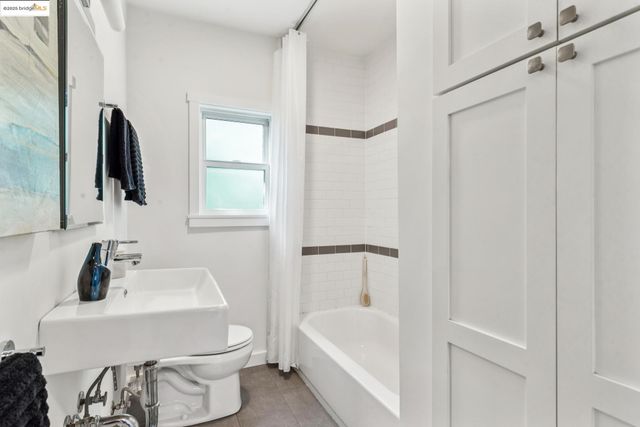 a bathroom with a sink toilet and tub