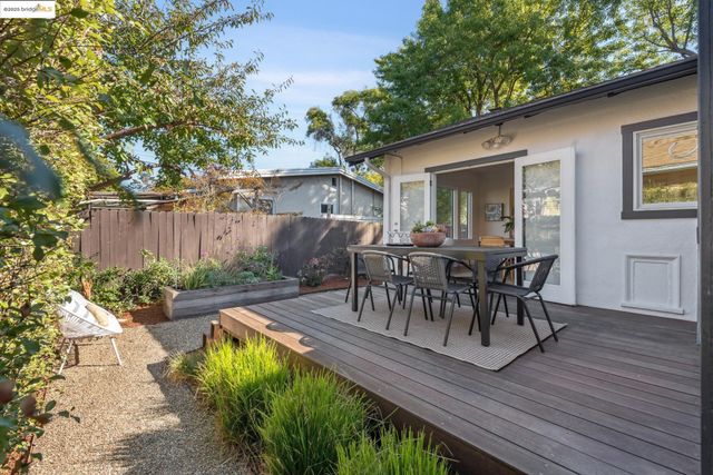 a view of a pathway both side of house