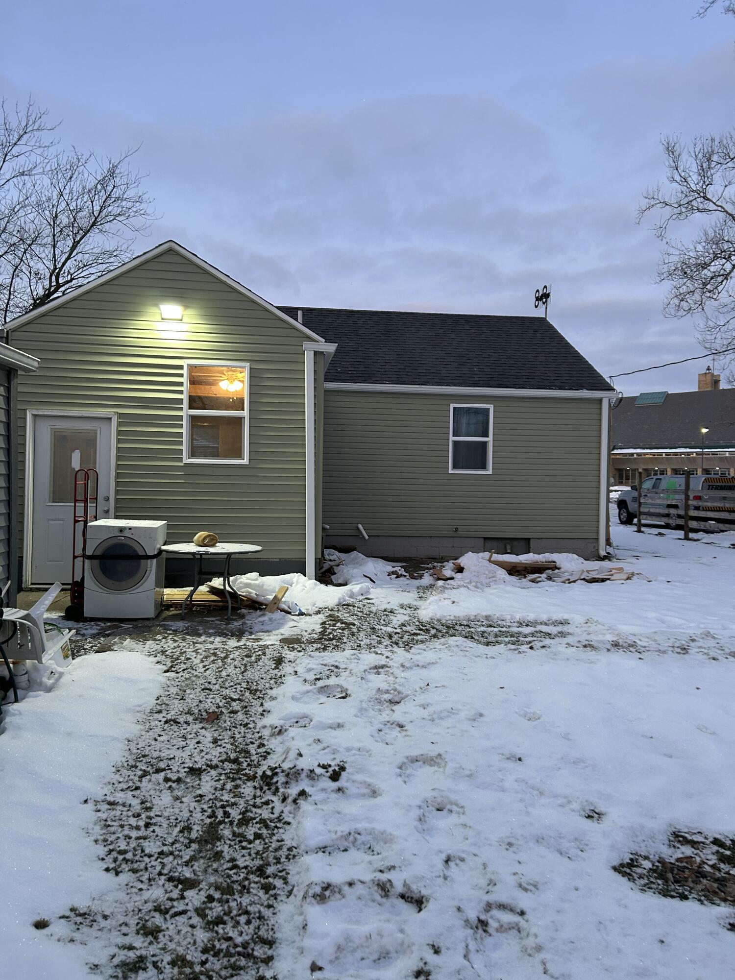 54252 North Ironwood Road South Bend, IN 46635 - Photo 2 of 21 a backyard of a house with wooden fence and a lounge chair