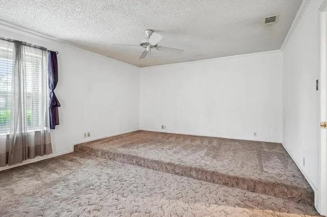 an empty room with a empty space and a window