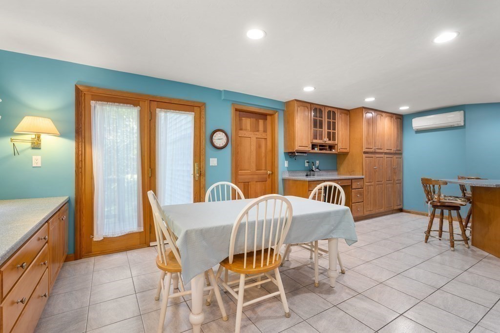 22 Robbin Road Canton, MA 02021 - Photo 11 of 40 a view of a dining room with furniture window and wooden floor