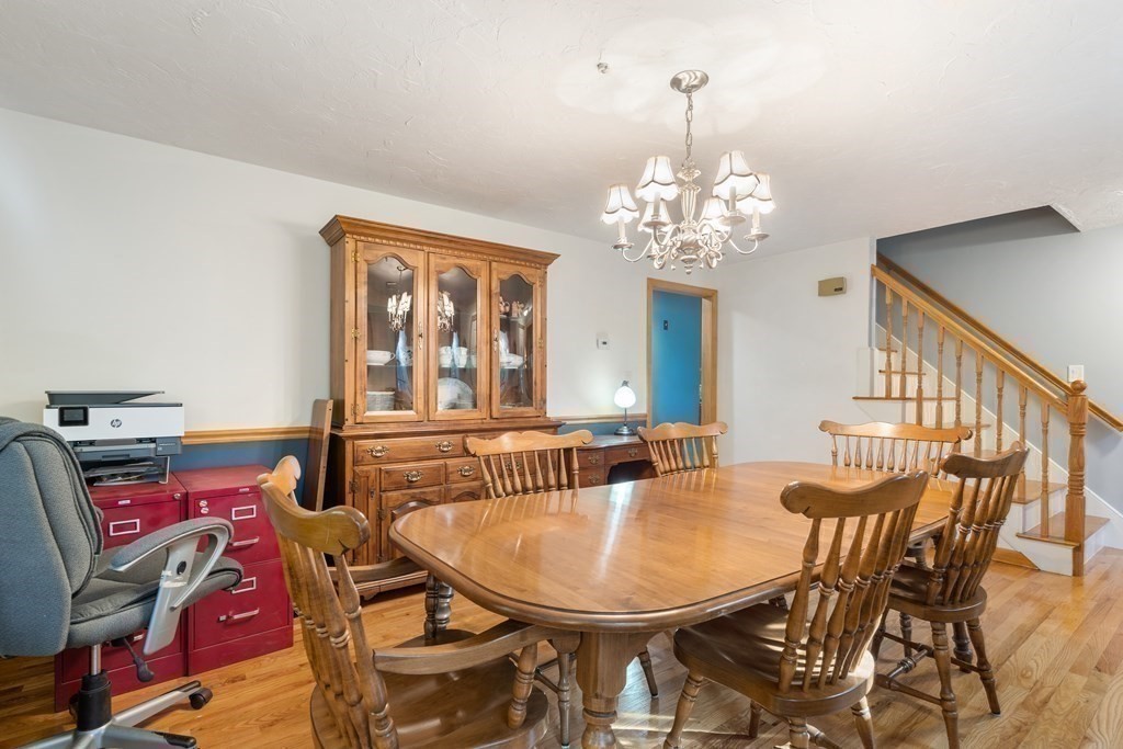 22 Robbin Road Canton, MA 02021 - Photo 15 of 40 a view of a dining room with furniture and a chandelier