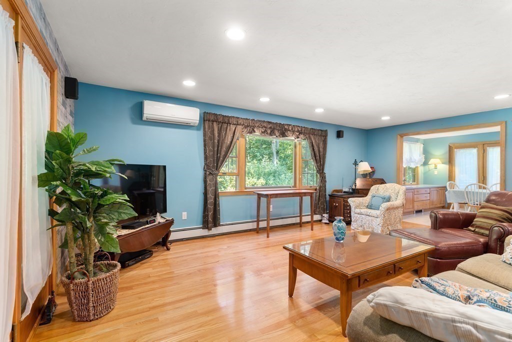 22 Robbin Road Canton, MA 02021 - Photo 18 of 40 a living room with furniture floor to ceiling window and wooden floor