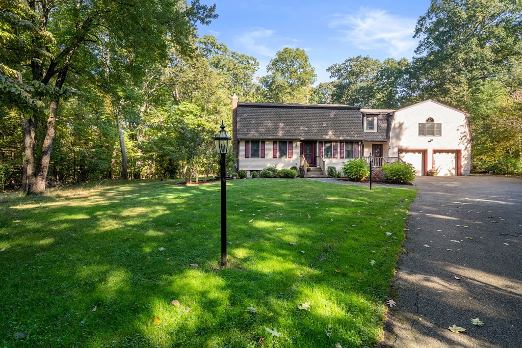 22 Robbin Road Canton, MA 02021 - Photo 2 of 40 a view of a house next to a big yard and large trees