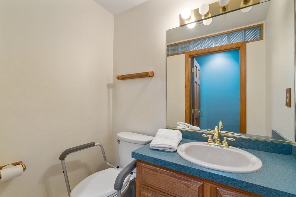 22 Robbin Road Canton, MA 02021 - Photo 21 of 40 a bathroom with a toilet sink and mirror