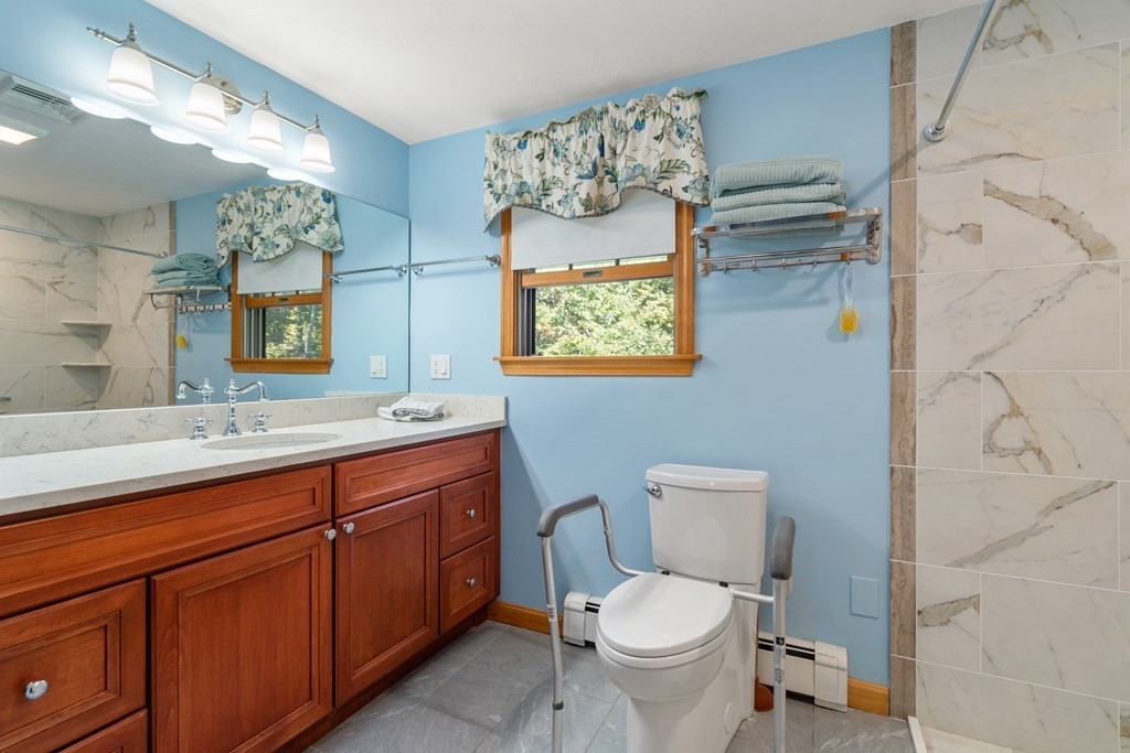22 Robbin Road Canton, MA 02021 - Photo 30 of 40 a bathroom with a toilet sink and mirror