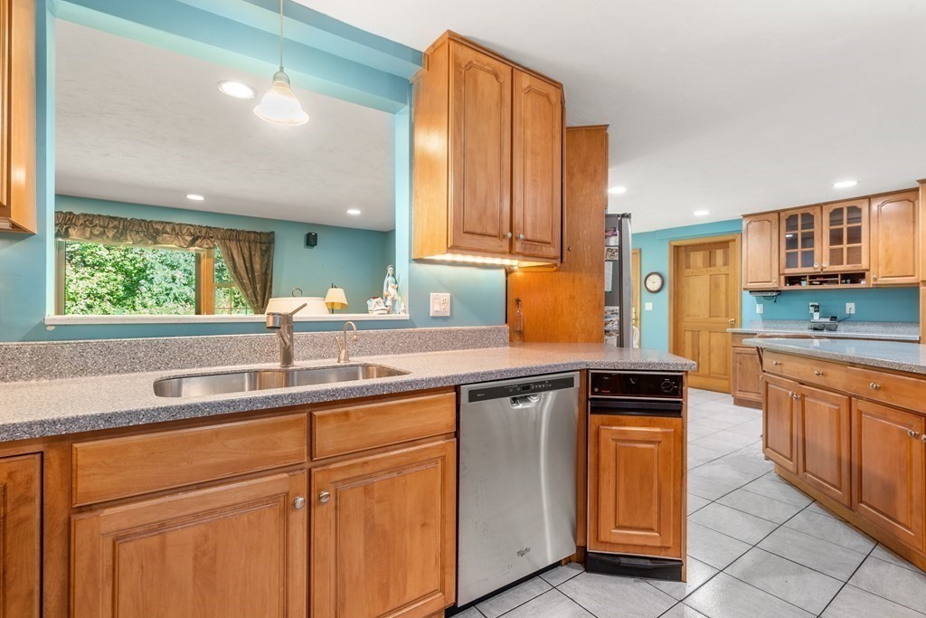 22 Robbin Road Canton, MA 02021 - Photo 9 of 40 a kitchen with granite countertop a sink and cabinets