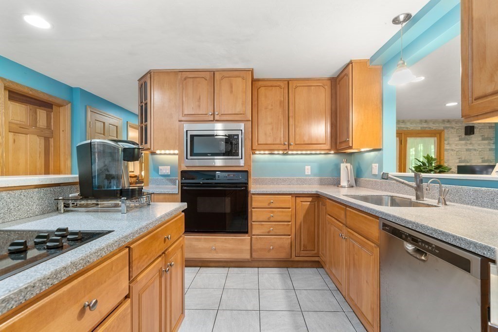 22 Robbin Road Canton, MA 02021 - Photo 10 of 40 a kitchen with stainless steel appliances a stove sink microwave and cabinets