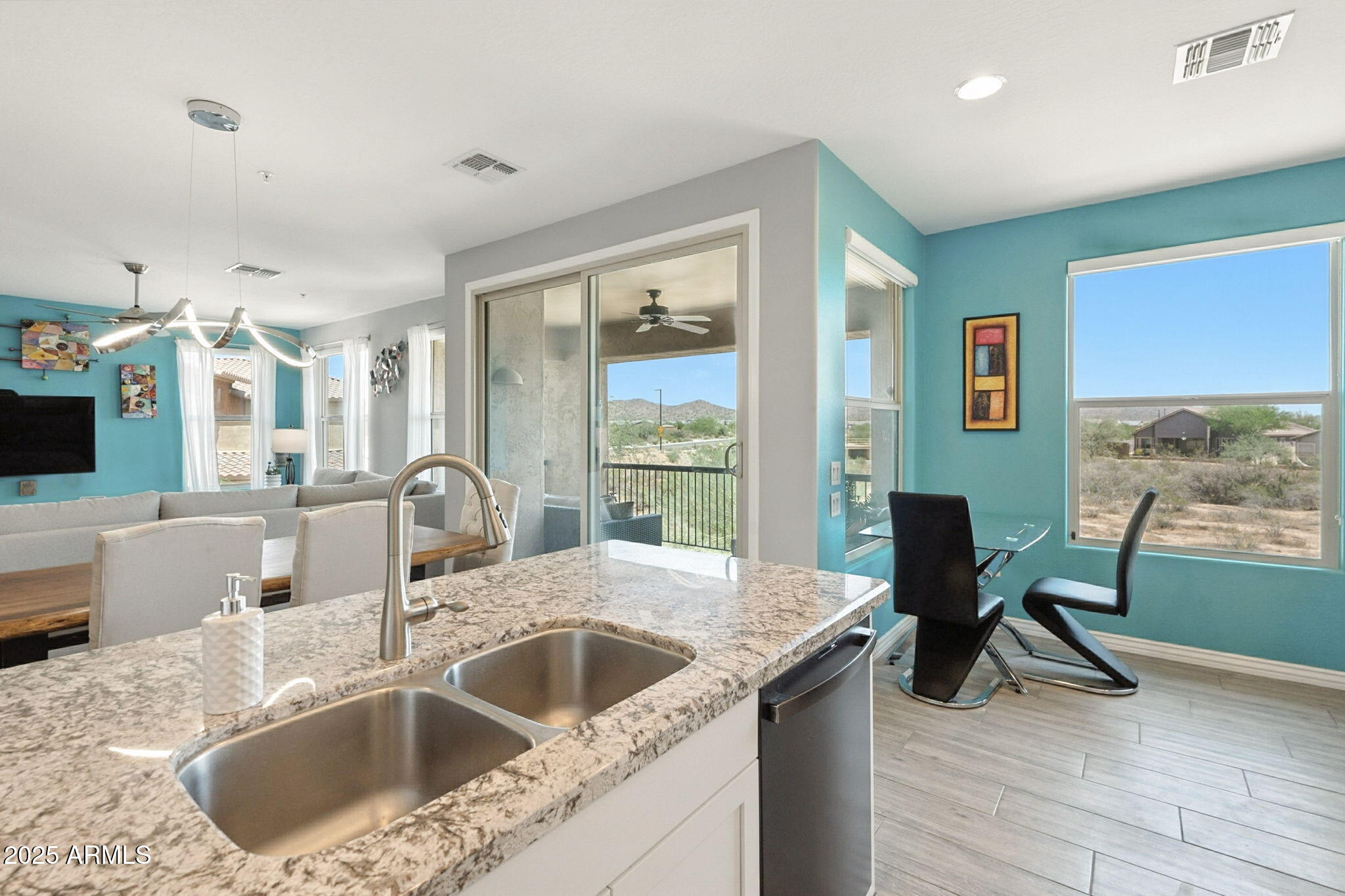 2425 West Bronco Butte Trail, Unit 2014 Phoenix, AZ 85085 - Photo 16 of 32 a kitchen with a sink and a refrigerator