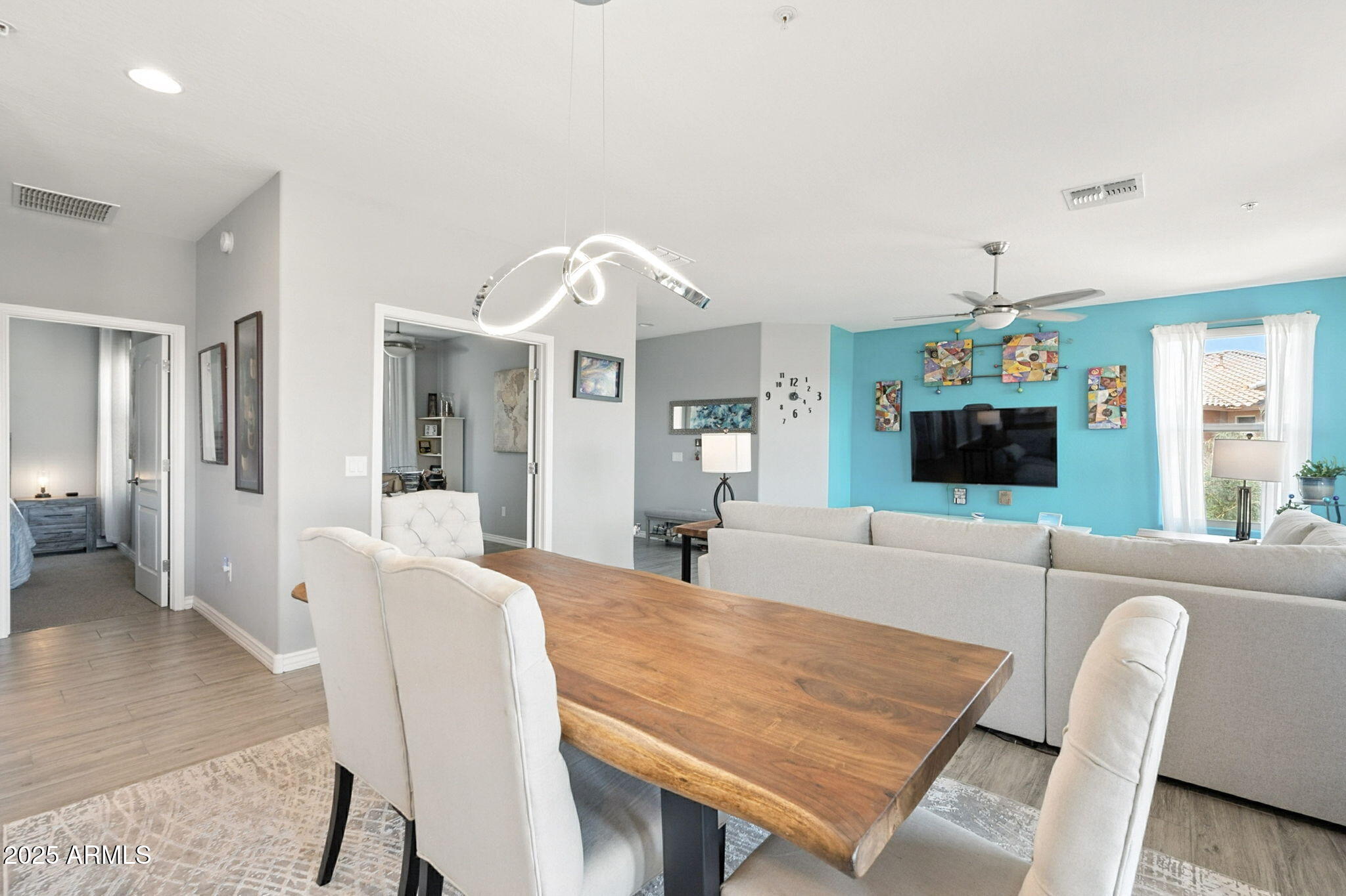 2425 West Bronco Butte Trail, Unit 2014 Phoenix, AZ 85085 - Photo 17 of 32 a living room with furniture and a flat screen tv