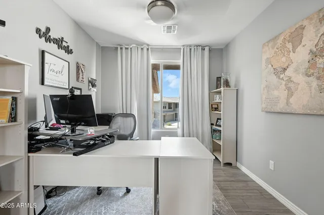 a work room with furniture and a window