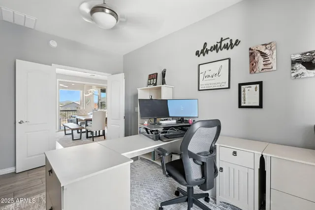 a bathroom with a sink a toilet and shower curtain