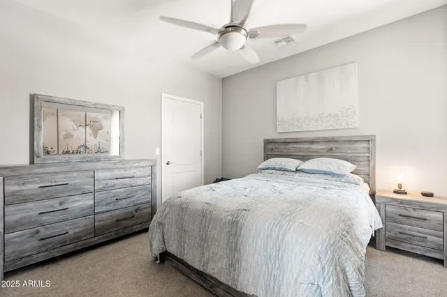 a bedroom with a bed and window