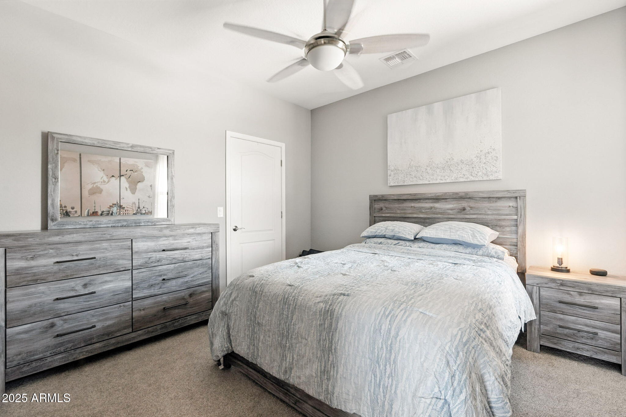 2425 West Bronco Butte Trail, Unit 2014 Phoenix, AZ 85085 - Photo 22 of 32 a bedroom with a bed and a dresser