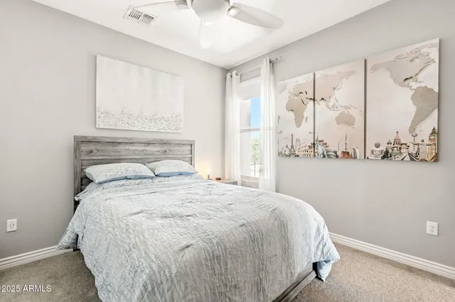 a bedroom with a bed and window