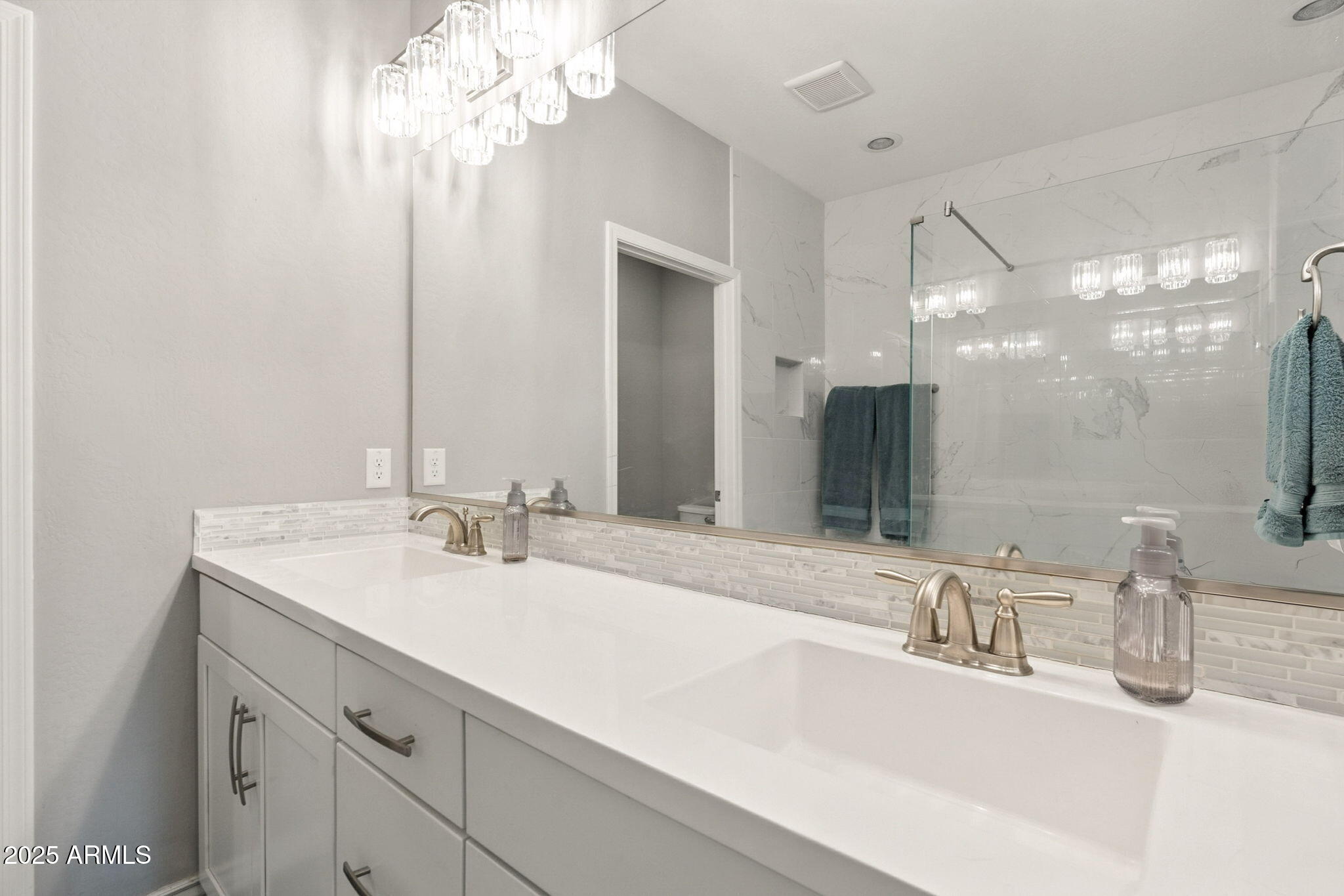 2425 West Bronco Butte Trail, Unit 2014 Phoenix, AZ 85085 - Photo 28 of 32 a bathroom with a sink double vanity and a mirror