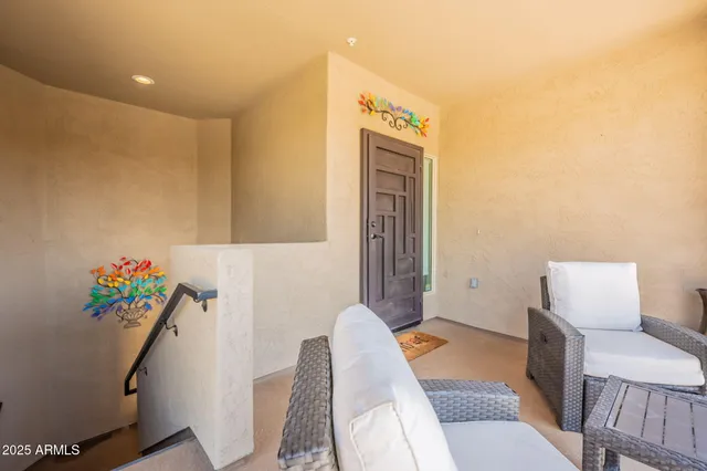 a view of hallway with furniture