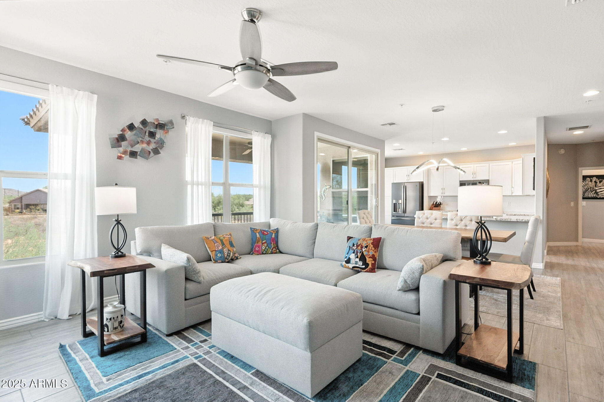 2425 West Bronco Butte Trail, Unit 2014 Phoenix, AZ 85085 - Photo 5 of 32 a living room with furniture and a window