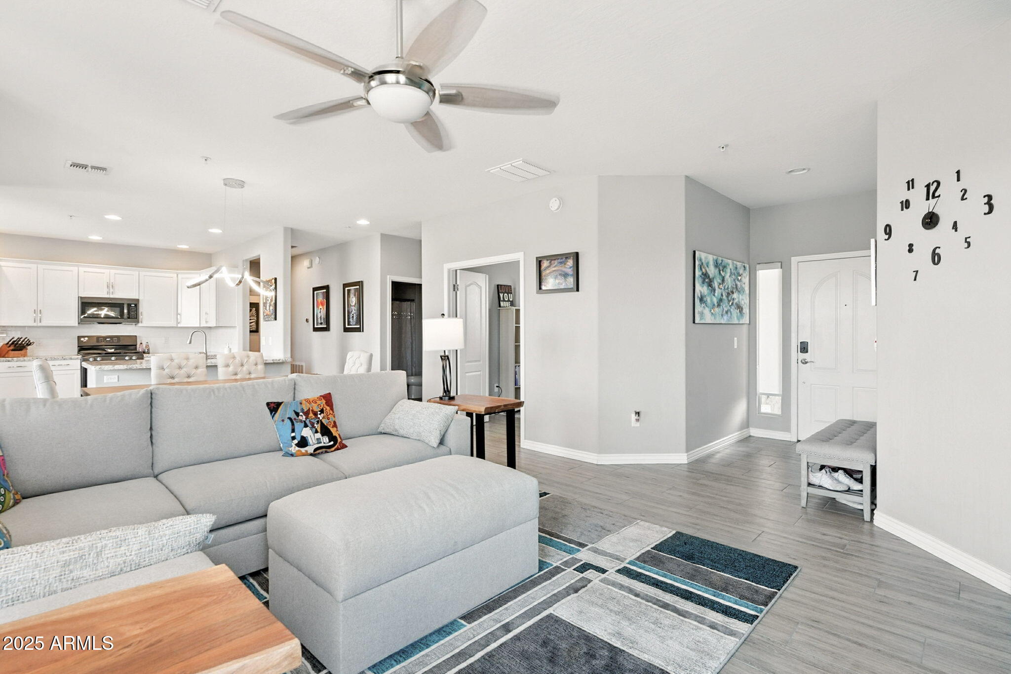 2425 West Bronco Butte Trail, Unit 2014 Phoenix, AZ 85085 - Photo 7 of 32 a living room with furniture and kitchen view