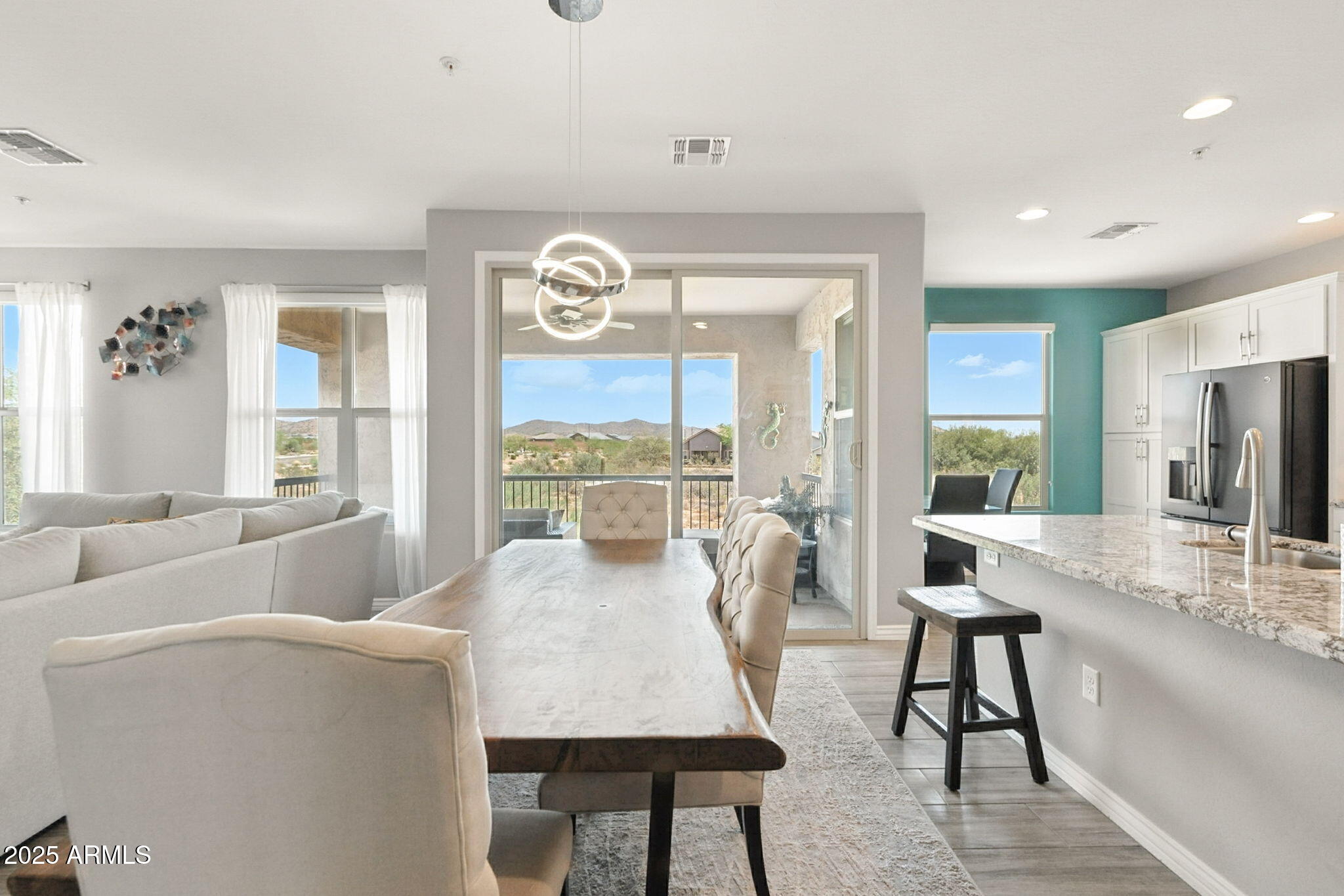 2425 West Bronco Butte Trail, Unit 2014 Phoenix, AZ 85085 - Photo 10 of 32 a living room with furniture and a large window