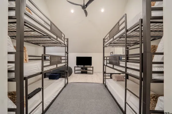 a bedroom with furniture and a window