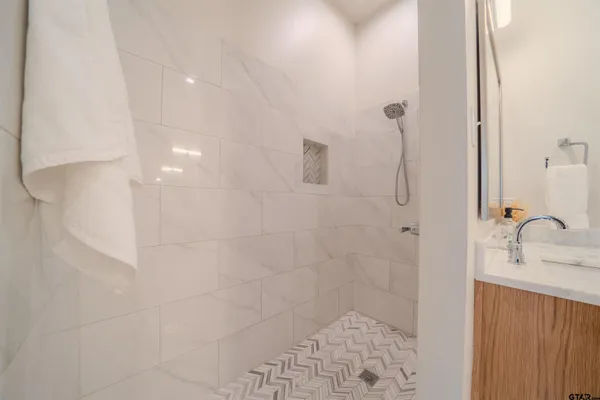 a view of bathroom with a washer and dryer