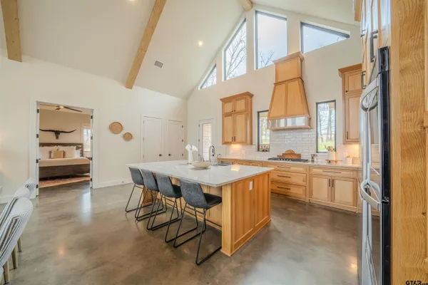 a kitchen with a sink and a stove top oven